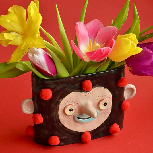 Vase with pom-poms for dried flowers