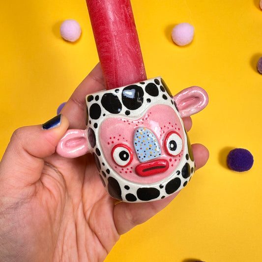 Speckled miniature candle holder with a little butt